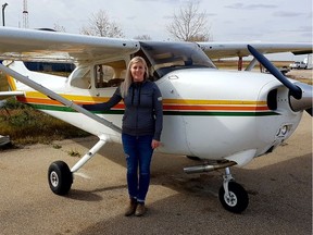 Laura Lawrence with the Cessna 172 in which she did some crop survey flying in 2016.