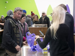 Customers inside Eden, a legal shop set up to sell cannabis, that opened Wednesday just west of Pilot Butte.