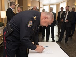 The Saskatchewan Association of Chiefs of Police and MedicAlert Foundation Canada partnered to better help officers quickly locate lost or missing vulnerable individuals so they can be quickly and safely returned to their loved ones. Regina Police Service Chief Evan Bray signs the partnership.