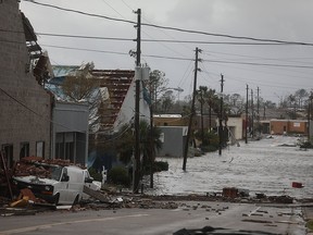 Damaged buildings and a flooded street are seen after hurricane Michael passed through the downtown area on Oct. 10, 2018 in Panama City, Fla.