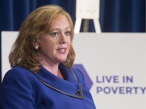 Lisa Macleod, Ontario's Children, Community and Social Services Minister makes an announcement on welfare rates at the Ontario Legislature in Toronto on Tuesday July 31, 2018.