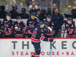 Regina Pats forward Austin Pratt celebrates with his teammates after scoring a goal during Saturday's WHL game against the Brandon Wheat Kings at the Brandt Centre.