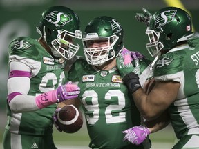 Roughriders defensive tackle Zack Evans, 92, celebrates after scoring on a fumble recovery Saturday against the B.C. Lions.