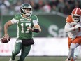 The B.C. Lions' Odell Willis, right, was fined by the CFL on Wednesday for a high hit on Saskatchewan Roughriders quarterback Zach Collaros on Saturday.