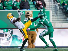 Nick Marshall, 3, tips a pass en route to making one of the Saskatchewan Roughriders' three interceptions Monday against the Edmonton Eskimos.