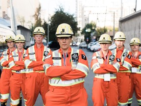 Kari Lentowicz, centre, and the other members of the Diamonds in the Rough mine rescue team are pictured in this handout photo.