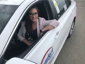 Outside of the Federated Co-op in Saskatoon's Stonebridge neighbourhood Shondra Boire, the Comfort Cab Operations Manager and a spokeswoman with the Saskatchewan Taxi Cab Association, can be seen in one of Saskatoon's operating taxis.