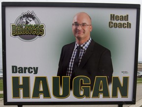 A photograph of head coach Darcy Haugan was placed along the boulevard on the road to Elgar Petersen Arena prior to the Humboldt Broncos home opener game against the Nipawin Hawks in Humboldt on Sept. 12, 2018. A southern Saskatchewan Bible college is honouring the memory of the coach of the Humboldt Broncos who died in crash of the team bus last April. Darcy Haugan wore jersey No. 22 when he was a star player with the Briercrest College Clippers in the late 1990s. That number is to be retired Friday night during a ceremony in Caronport as part of the college's alumni weekend.