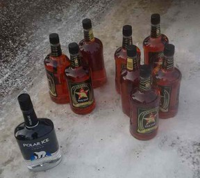 Further investigation revealed eight 66-ounce bottles of whiskey and one 66-ounce bottle of vodka in the vehicle, which were all seized.