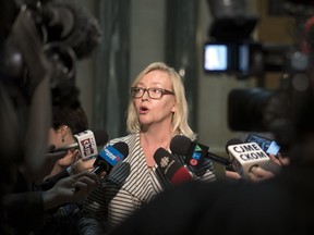 Jo-Anne Dusel, executive director PATHS, speaks to the media after the  introduction of Clare's Law during Question Period at the Legislative Building in Regina.  Clare's Law allows police to release information about someone's violent or abusive past to intimate partners who may be at risk.