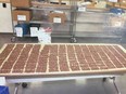 Marijuana-laced chocolate bars are shown at a pot-shop in Toronto during a raid in this evidence photo. A Toronto police officer who ate a marijuana-laced chocolate bar seized in a pot-shop raid has pleaded guilty to attempting to obstruct justice. Vittorio Dominelli says he is remorseful and ashamed of his actions on the evening of Jan. 27.