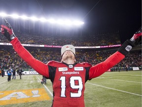 Quarterback Bo Levi Mitchell, shown celebrating a Grey Cup championship with the Calgary Stampeders in 2018, re-signed with the defending CFL champions after considering a lucrative offer from the Saskatchewan Roughriders.