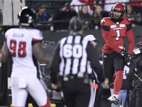 Ottawa Redblacks defensive lineman Avery Ellis (98) looks on as Calgary Stampeders wide receiver Lemar Durant (1) celebrates a touchdown during the first half of the 106th Grey Cup at Commonwealth Stadium in Edmonton, Sunday, November 25, 2018.