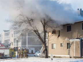 REGINA, SASK : November 8, 2018  -- Firefighters attend to a house fire at a condo complex just off or Rochdale Boulevard. BRANDON HARDER/ Regina Leader-Post
