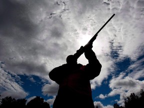 A rifle owner checks the sight of his rifle