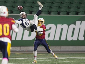 The Balgonie Greenall Griffins' Branson Pipko attempts to make an acrobatic catch in front of the Sheldon-Williams Spartans' Max Polischuk during Friday's Regina Intercollegiate Football League Stewart Conference final at Mosaic Stadium. Sheldon won 24-3.