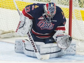 Regina Pats goaltender Max Paddock stops a shot against the Swift Current Broncos in WHL action at the Brandt Centre on Saturday.