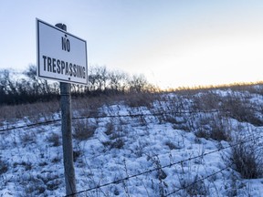 A No Trespassing sign at the edge of a field near McLean.