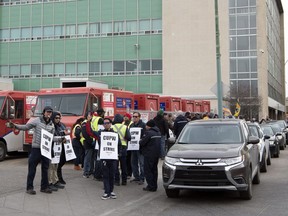 Canadian Union of Postal Workers (CUPW) members picket on Saskatchewan Drive in Regina. This is part of rotating national strike action.