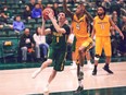 University of Regina Cougars guard Benjamin Hillis, shown driving to the basket Saturday against the visiting University of Manitoba Bisons, hit the game-winning basket with 12 seconds left to cap Regina's rally from fourth-quarter deficits of 11 and nine points.