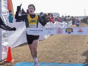 Regina's Ron MacLean crosses the finish line Saturday in Kingston, Ont., to win the under-18 boys title at the Canadian cross-country championships.