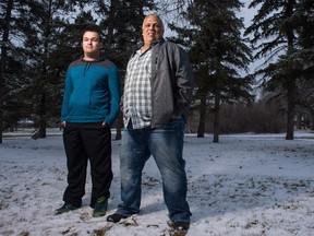 Dwayne Hnatiw, right, and his son Connor stand in a park near their home on Nov. 3, 2018. The father-son duo started a window washing business called Crystal Clear Windows as a way to work within the confines of their mental health issues.