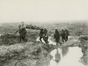 To assist in the commemoration of the centenary of the First World War, the Canadian War Museum is making a selection of its archival photos available for media and educational use, at no cost. All published images, whether in print or online, must be accompanied by proper accreditation.   Wounded Canadian soldiers on their way to an aid post during the Battle of Passchendaele, November 1917.  George Metcalf Archival Collection CWM 19930013-464} O.2201 © Canadian War Museum ORG XMIT: POS1808071415583074