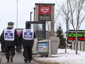 Co-op employees picket while on strike at the gas station and liquor store on near the intersection of of Betts Avenue and Shillington Crescent in Saskatoon, SK on Monday, December 10, 2018.