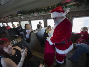 Santa meets passengers during the Magical Christmas Express train that travels from Wakaw to Cudworth near Wakaw,Sk on Saturday, December 15, 2018.