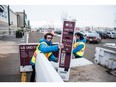 Best Buy employees Brayden Nordquist (left) and Jonathan Cruz load a pair of 75" TVs into a customer's truck on Boxing Day in Saskatoon, SK. on Wednesday, December 26, 2018.