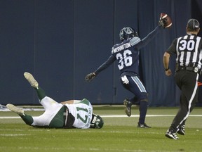 This interception-return touchdown by the Toronto Argonauts' Trumaine Washington, shown running away from quarterback Zach Collaros on Sept. 22, typified the Saskatchewan Roughriders' offensive woes in 2018.