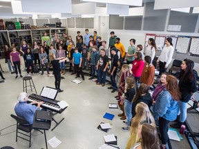 Russell Baird, shown on the piano, and Deidre Baird, conducting, lead the Campbell Collegiate chamber choir, which is performing with the Regina Symphony Orchestra on Saturday, Dec. 15 for A Candlelight Christmas.