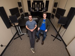 Kenton Evenson (left) and Joel Makar sit in an edit suite in the film department at the University of Regina. They created their award-winning film Beta Test as their fourth-year film project.