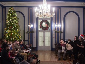 A group of singers from the University of Regina serenade a crowd with Christmas carols in the ballroom at Government House on Dewdney Avenue in December. On Jan. 1 is the New Year's Day Levee.