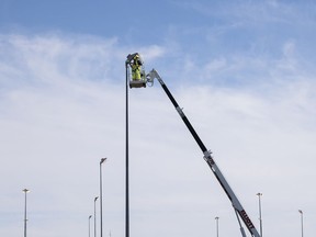 City of Regina crews perform maintenance on the street lights along Arcola Avenue in Regina in this photo from May.