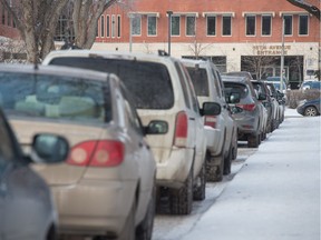 St. John Street, just south of the Regina General Hospital, is full of cars along the one side of the street that allows parking.