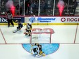 The Regina Pats' Robbie Holmes, left, celebrates a goal against the Hamilton Bulldogs during the 2018 Memorial Cup at the Brandt Centre.