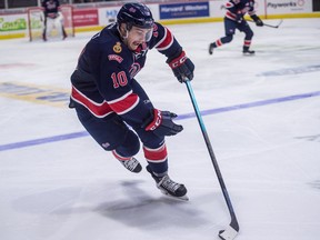 The Regina Pats' Austin Pratt carries the puck during a WHL game against the Prince Albert Raiders on Saturday at the Brandt Centre.