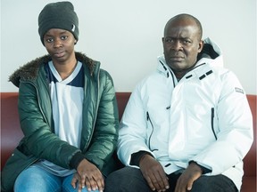 David Chukwudum, right, and Chinaza Chukwudum, are father and sister of missing student Promise Chukwudum. They are pictured here sitting on a bench at the University of Regina. Promise, who was studying computer science at the university, has been missing since Nov. 17.