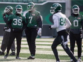 REGINA, SASK : November 9, 2018  -- Saskatchewan Roughriders'  defensive powerhouses Willie Jefferson (7) and Charleston Hughes (39) share a word during a practice at Mosaic Stadium. BRANDON HARDER/ Regina Leader-Post