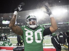 Saskatchewan Roughriders fullback Spencer Moore encourages the fans to cheer against the Winnipeg Blue Bombers  in second half CFL West semi-final action at Mosaic Stadium in Regina.