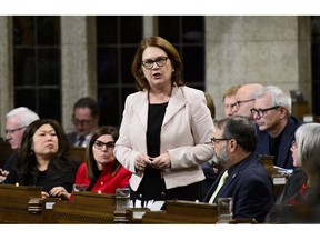 Jane Philpott, Minister of Indigenous Services, stands during question period in the House of Commons on Parliament Hill in Ottawa on Monday, Dec. 10, 2018.