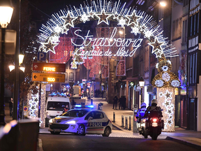 A police car drives in the streets of Strasbourg, France, after a deadly mass shooting, on Dec. 11, 2018.