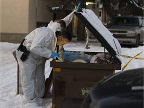 Police investigate near an apartment at 79 Avenue and 71 Street where two children were found dead on Thursday, Dec. 6, 2018, in Edmonton.