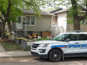 A police cruiser sits out in front of a home on the 1100 block of Retallack Street.