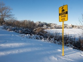 A thin ice sign indicates the need for caution on the edge of Wascana Lake and on other water bodies around the city.