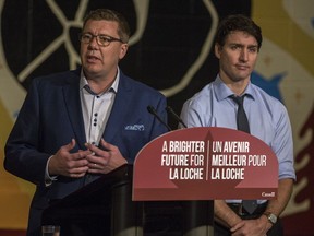 Prime Minster Justin Trudeau looks on as Saskatchewan Premier Scott Moe speaks during a funding announcement at Dene High School in La Loche, SK on Wednesday, January 23, 2019.