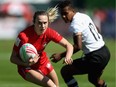Julia Greenshield of Canada runs with the ball on day one of the Emirates Dubai Rugby Sevens - HSBC World Rugby Sevens Series at The Sevens Stadium  on November 29, 2018 in Dubai, United Arab Emirates.