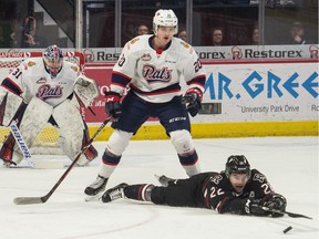 The Red Deer Rebels' Brandon Hagel tries to get his stick on the puck while being defended by the Regina Pats' Kyle Walker (20) during a recent WHL game at the Brandt Centre.