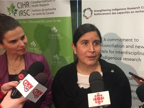 University of Saskatchewan soil scientist Melissa Arcand, right, and federal science and sport minister Kirsty Duncan speak at Wanuskewin Heritage Park during an announcement of $5.6 million for Indigenous Research Capacity and Reconciliation Grants.